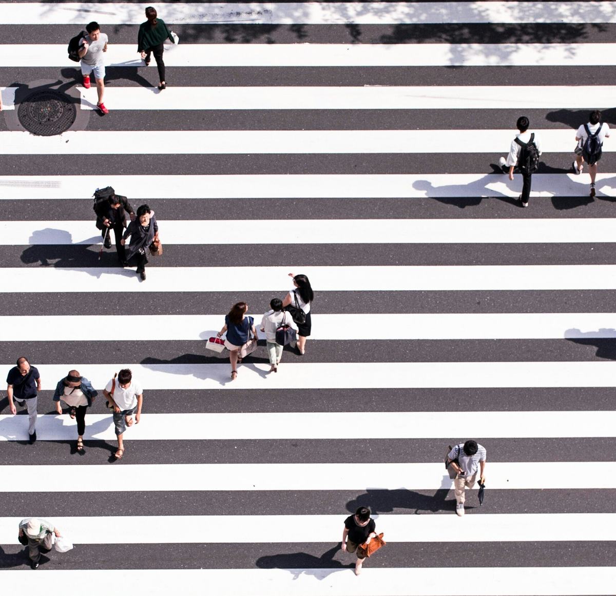 Aerial view of people crossing an intersection
